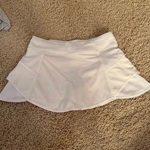 athleta girl skirt, front pocket in waistband, drawstring in waist, very comfy.